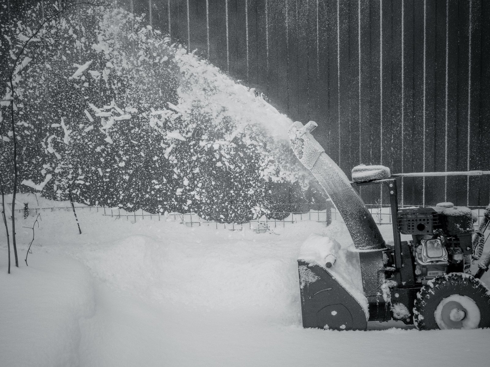 Snowblower at work clearing snow on a winter day