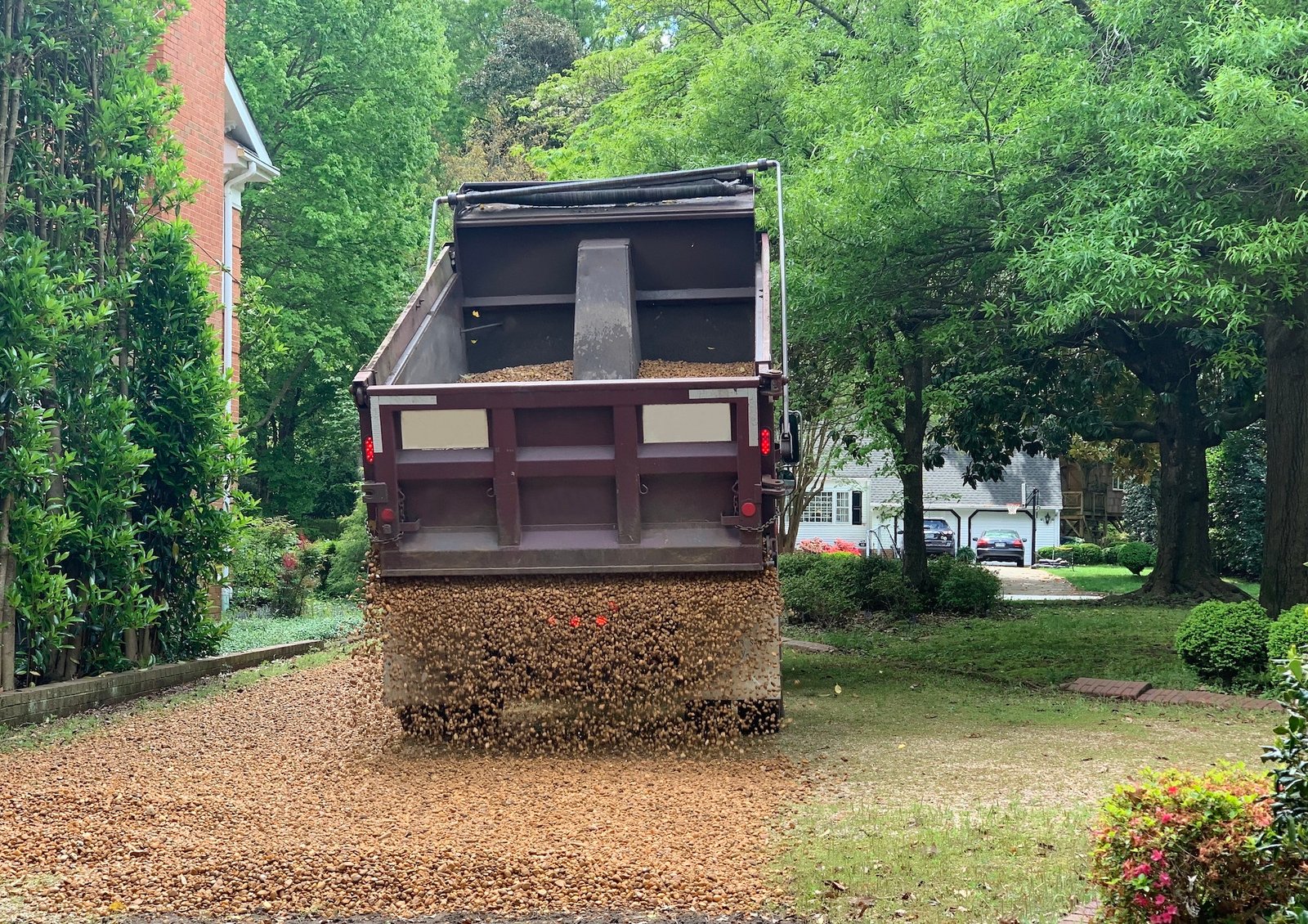 New gravel being put on a home driveway in Iowa